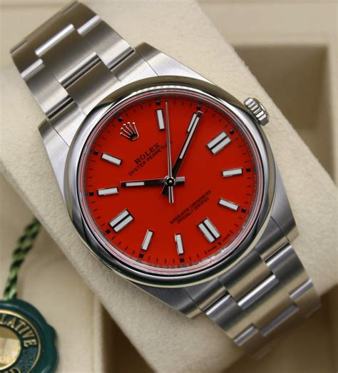 rolex oyster perpetual 124300 with coral red dial